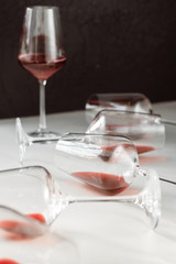 Glasses of red  wine  on white and dark background,  copy space.  Wine degustation concept