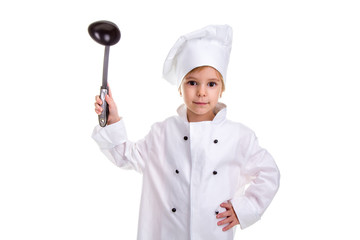 Girl chef white uniform isolated on white background. Holding black ladle up with another hand on the waist. Looking at the camera. Landscape image