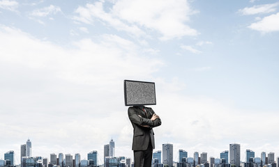 Businessman with TV instead of head.