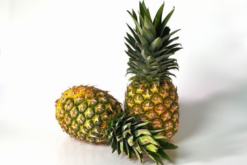 Close up view of two colorful pineapples isolated. Food concept. Healthy eating concept. Beautiful nature background.