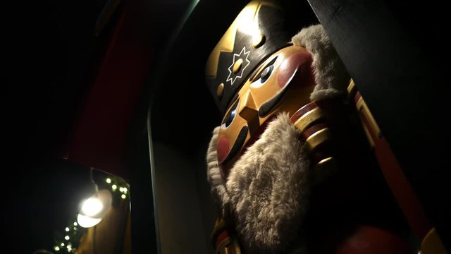 A nutcracker statue in a darkened area
