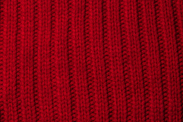texture of knitted stripes of red yarn