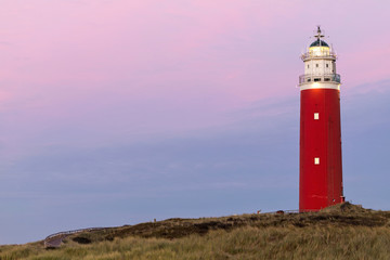 Fototapeta na wymiar Eierland Lighthouse on the northernmost tip of the Dutch island of Texel after dusk