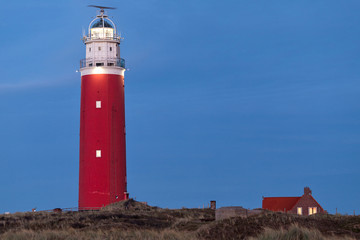 Fototapeta na wymiar Eierland Lighthouse on the northernmost tip of the Dutch island of Texel after dusk