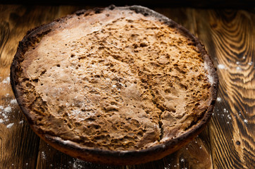 bread lies on a wooden surface