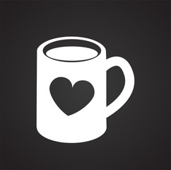 Mug with heart on black background icon