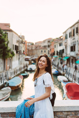Fototapeta na wymiar young girl walks the streets of Venice