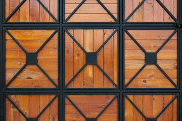 wooden gate with wrought iron as background