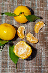 bright, juicy tangerines with green leaves. Cleaned tangerines. Vitamin C. Healthy vegetarian food.