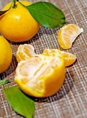 bright, juicy tangerines with green leaves. Cleaned tangerines. Vitamin C. Healthy vegetarian food.