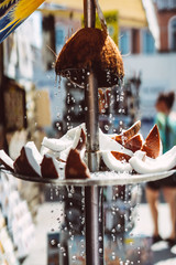 pieces of fresh coconut lie on a plate