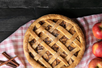 Above view of apple pie and apple fruits. Traditional sweet pie. Home Baking