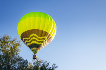 Colorful hot air balloon against the blue sky