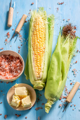 Preparations for grilling tasty corncob with salt and butter