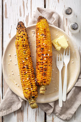 Fresh and healthy corn from grill with butter and salt