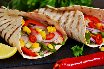 Taco - traditional dish of Mexican cuisine. Mexican tacos with beef, vegetables and sauce. Top view.