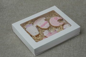 Delicious baby shower cookies, closeup.. Baby shower cookies in box.