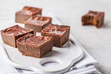 Raw Vegan Chocolate Cake Slices on white background.