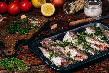 Hake carcasses on baking sheet