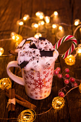Christmas cup with hot chocolate and whipped cream.