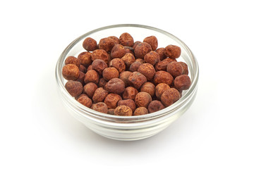Grey peas in a glass bowl, isolated on a white background. Close-up.