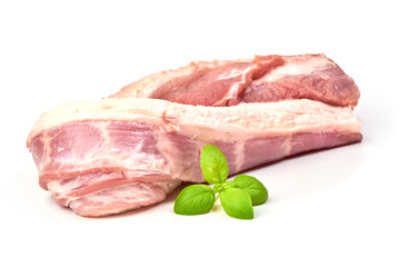Fresh Raw Pork Tenderloin with basil leaves, isolated on a white background. Close-up.