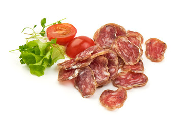 Thin Sliced Jerked Sausage from pork with lettuce and tomatoes, isolated on a white background. Close-up