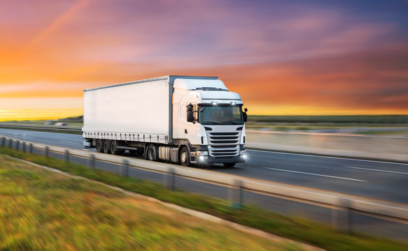 Truck with container on road, cargo transportation concept.