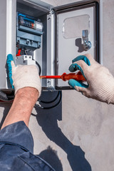 Replacing the old electricity meter with a new one. Repair of electrical equipment