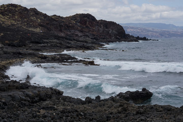 Dark lava rocks with Atlantic coast