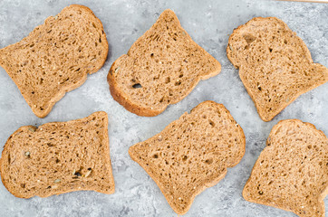 Assortment of rye bread for cooking healthy sandwiches. Top view flat lay background
