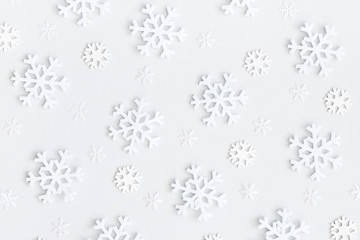 Christmas or winter composition. Christmas pattern made of snowflakes on pastel gray background. Flat lay, top view