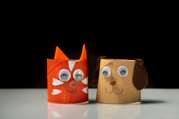 Cat and dog made of toilet paper roll by a child