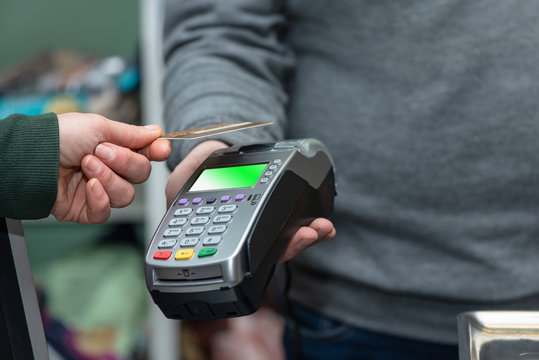 NFC technology, customer do payment with contactless credit card. Credit card reader implements payment execution