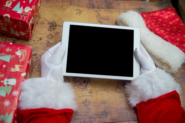 Christmas ready Santa Claus delivering presents, closeup. Busy hurry holiday express time item...