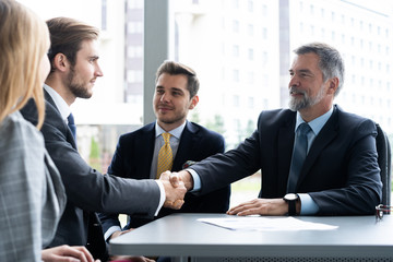Business people shaking hands, finishing up a meeting. Handshake. Business concept.