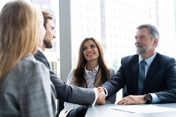 Business people shaking hands, finishing up a meeting. Handshake. Business concept.