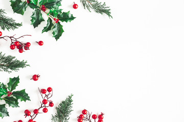 Christmas composition. Frame made of christmas plants on white background. Flat lay, top view, copy...