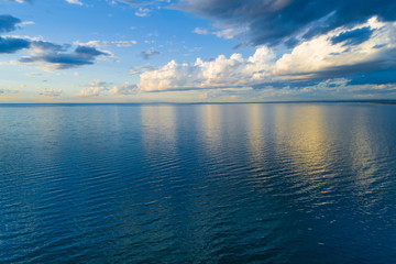 Clouds over water at sunset - aerial view