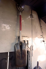Shovel on coal in steam locomotive