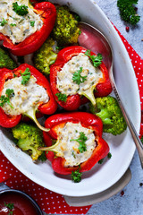 Red paprika stuffed with meat and cheese and spices. Baked stuffed peppers. Top view. Advertising menu.