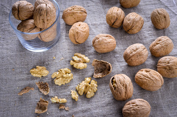 Walnuts on canvas. The shell of the nuts, nut core.