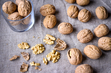 Walnuts on canvas. The shell of the nuts, nut core.