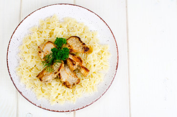 Pasta farfalle with grilled chicken fillet