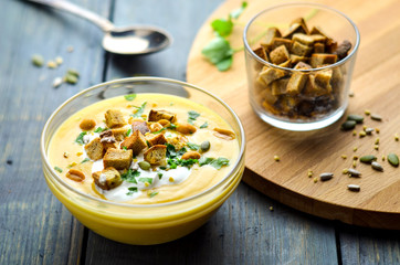 Vegetable soup with croutons, pumpkin seeds and greens. Menu of vegetables and nuts. Vegetarian...