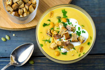 Vegetable soup with croutons, pumpkin seeds and greens. Menu of vegetables and nuts. Vegetarian dinner.