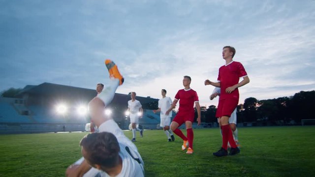 Soccer Player Receives Successful Pass and Kicks Ball and Scores Amazing Goal doing Doing Verticle Bicycle Kick. In Slow Motion.
