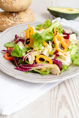 Vegetable salad with avocado, feta cheese, and vegetables