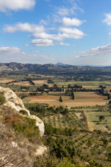 Fototapeta na wymiar The valley between Les Baux de Provence and the Alpilles mountains are dotted with farms