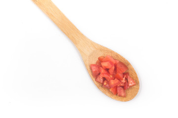 Chopped Tomatoes in a spoon Top view